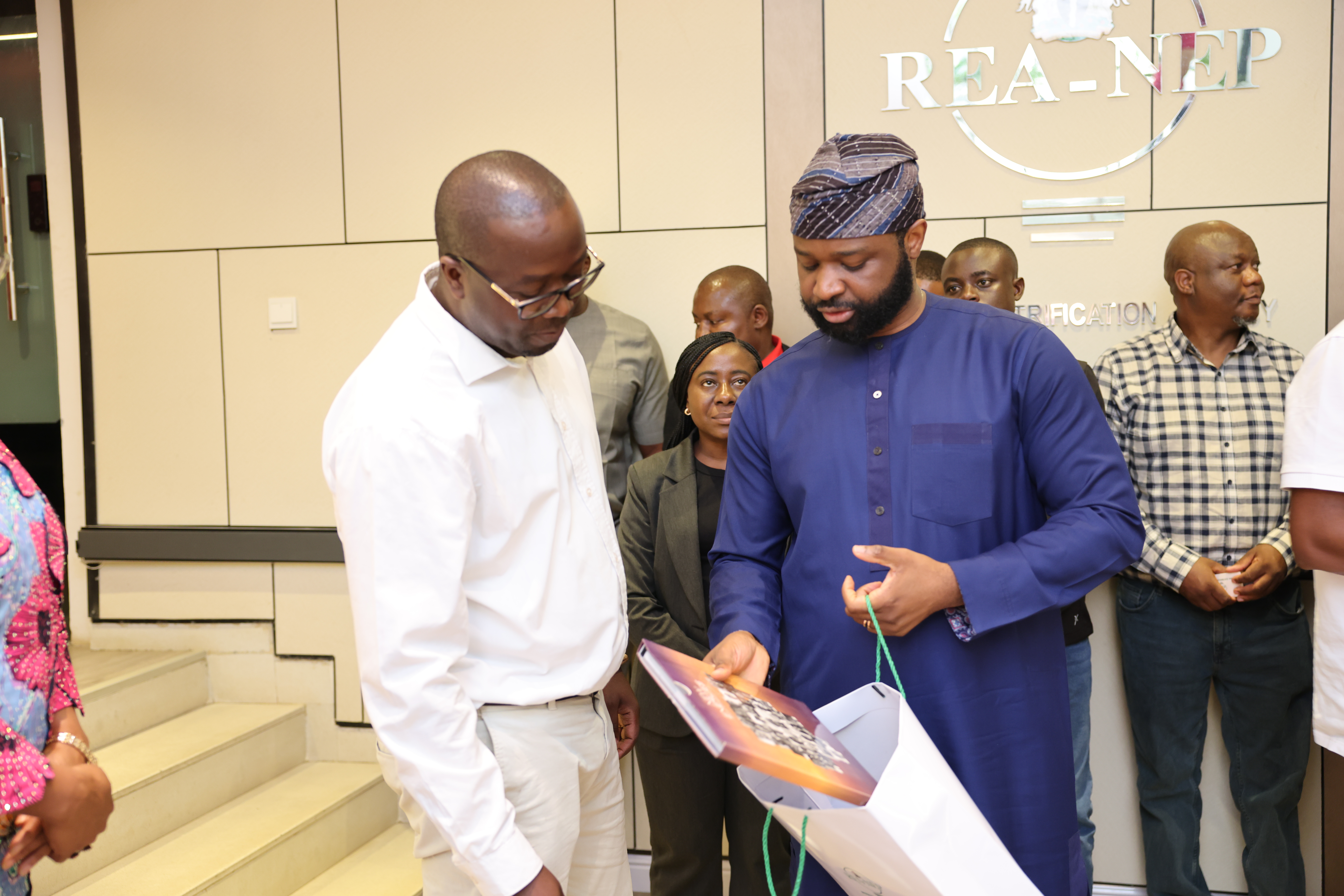 Head of the Nigeria Electrification Programme, REA, presents the New Energies photobook