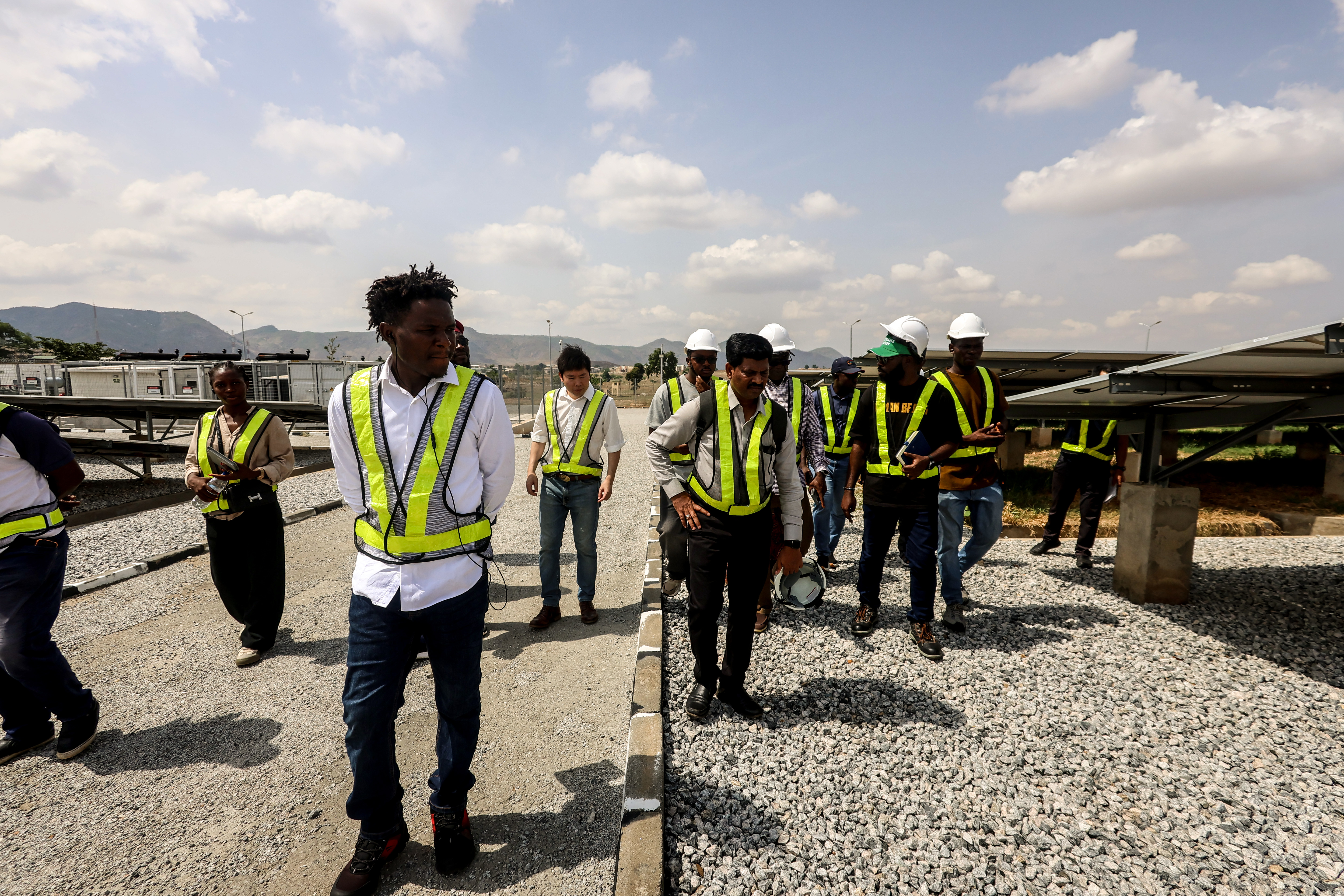 The REA-NEP technical team and developers assess the 3.3MW captive hybrid solar facility to guide the large-scale rollout of interconnected mini-grids across Nigeria.