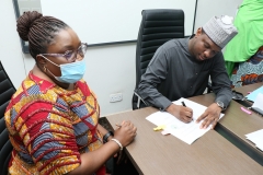 REA-MD-signing-agreement-wit-Solar-Sisters-Inc