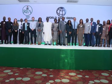 Group photo of REA Mangement, World Bank, and PMU officials