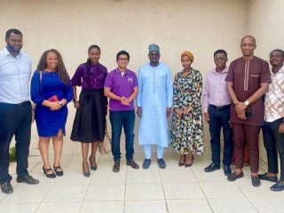 GROUP PHOTO_ HUSK POWER TEAM WITH ABBA ALIYU AND NEP-PMU STAFF DURING THE COURTESY VISIT